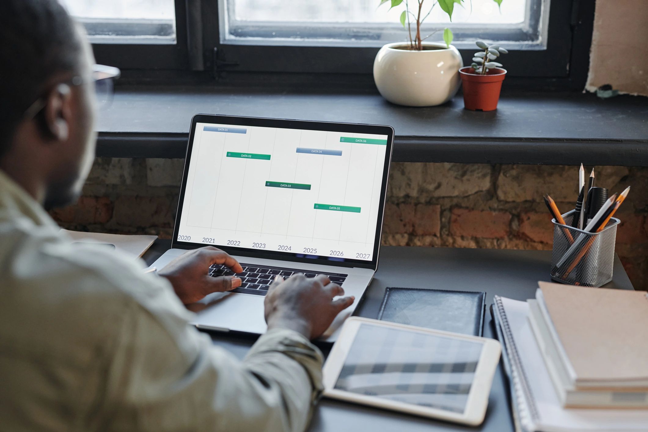 Person reviewing data on a laptop